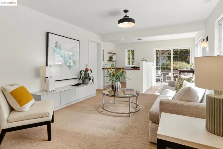 Lower level sitting room or media room, looking to wet bar area and sliding doors to the yard