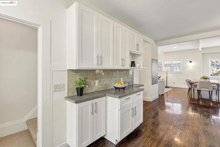 Kitchen to stairs to upper level