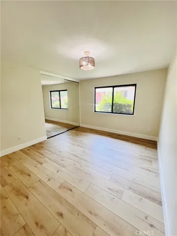 Mirrored wardrobe doors in primary bedroom