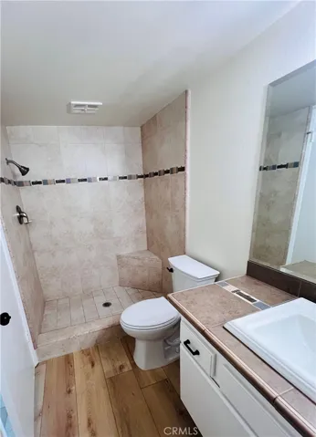 Beautiful tile shower with new shower head and valve