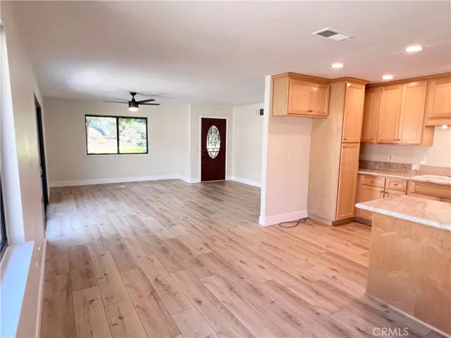 Kitchen to your right with large space for refrigerator