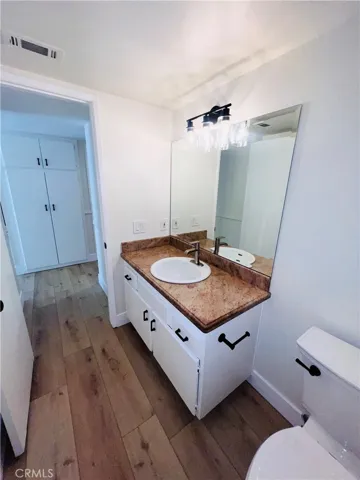 Storage closet in hallway across from guest bath.