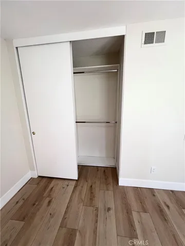 One bedroom has closet organizer
