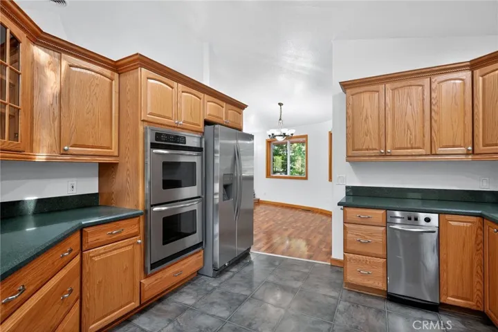 Double Oven, Refrigerator, Tash Compactor, Plenty Cabinets and Granite Counter tops
