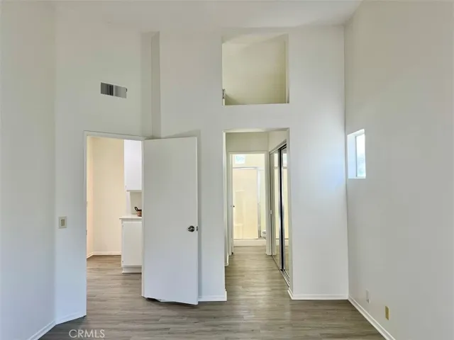 Master bedroom with towering ceilings.