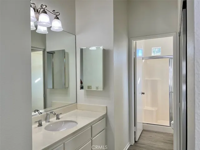 Master bedroom bath with mirrord wardrobe and upgraded light fistures.