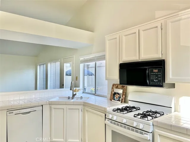 Kitchen opening to living room area.