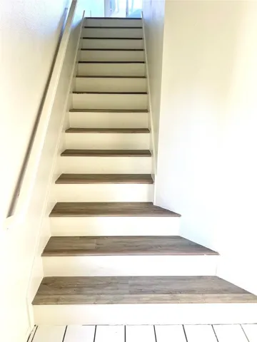 Laminate stairway leading to main living area.