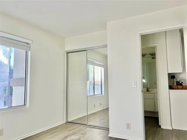 Second bedroom with mirrored wardrobe and next to second bathroom.