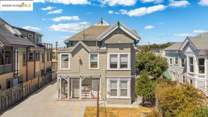 Back of property with a residential view