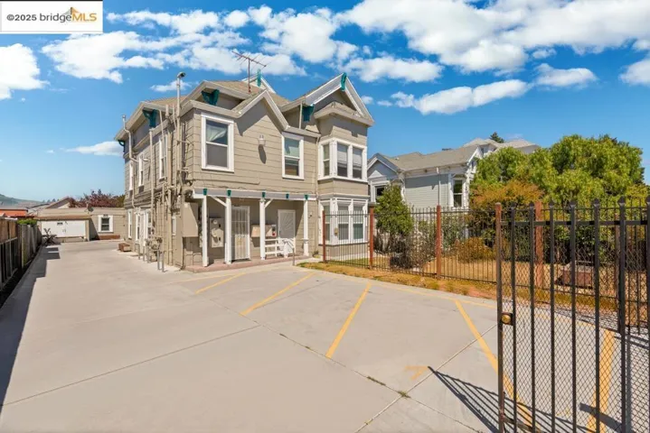 View of front of house featuring uncovered parking