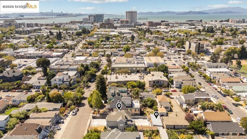 Aerial overview of property's location with a water and mountain view