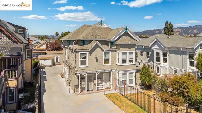 View of front of house featuring a residential view and a shingled roof
