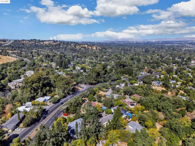 Aerial overview of property's location featuring nearby suburban area