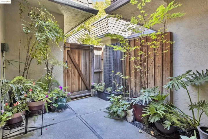 View of patio with a gate