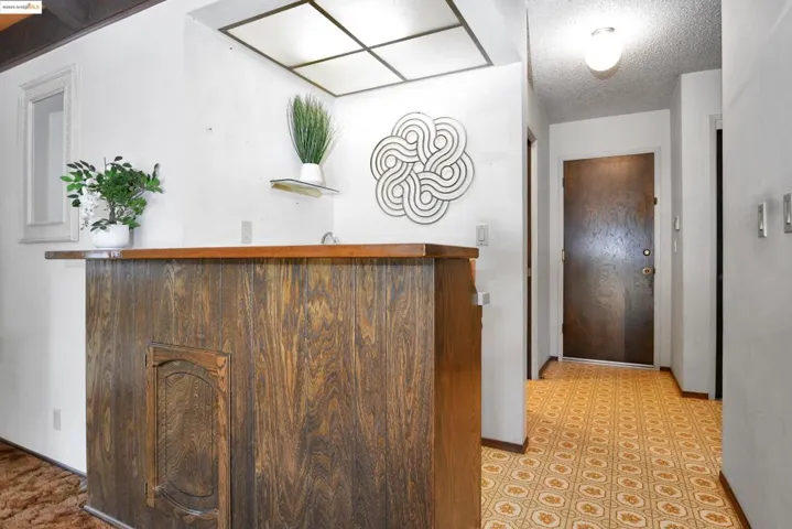 Reception featuring a textured ceiling