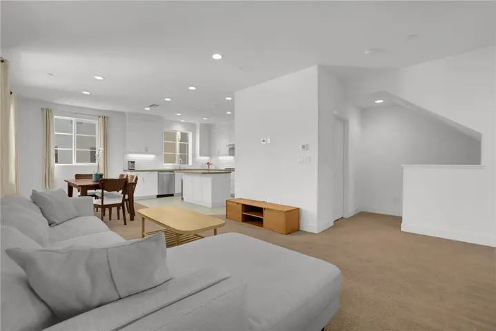 Second floor is Great room, Dining, Kitchen, Half bath and half covered Patio.