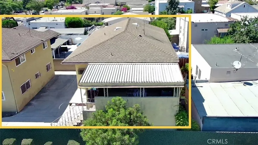 Side angle of back building that includes 1 unit, plus 5 carport spaces.
