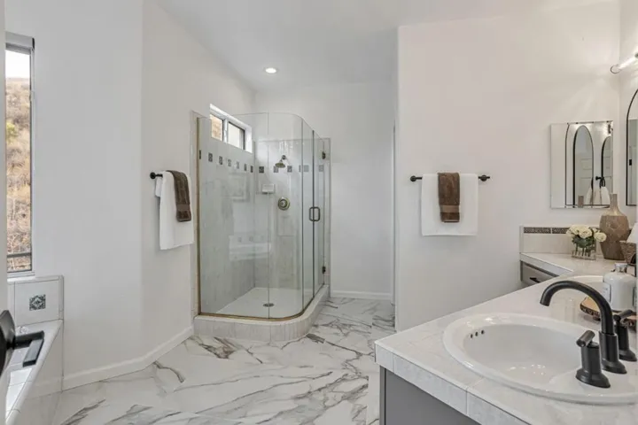 Owner's suite bath with stall shower