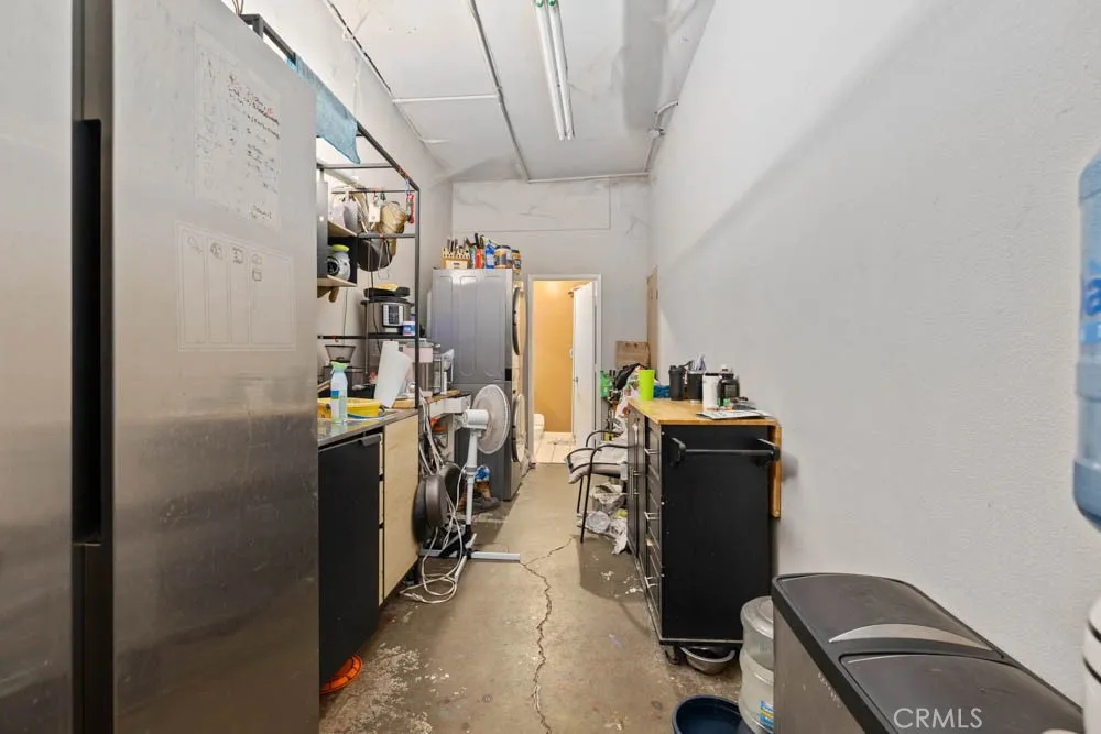 The back office space, double door entry and kitchenette.