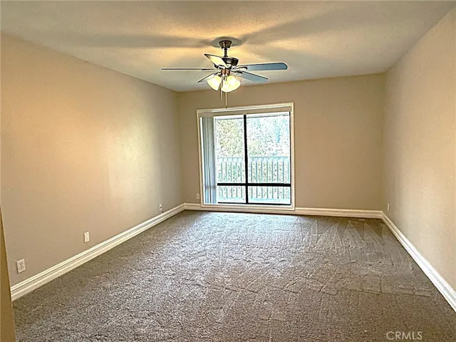 Primary bedroom with new paint and carpet.