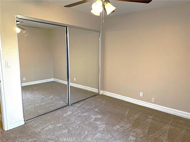 Bedroom two with new carpet and paint.