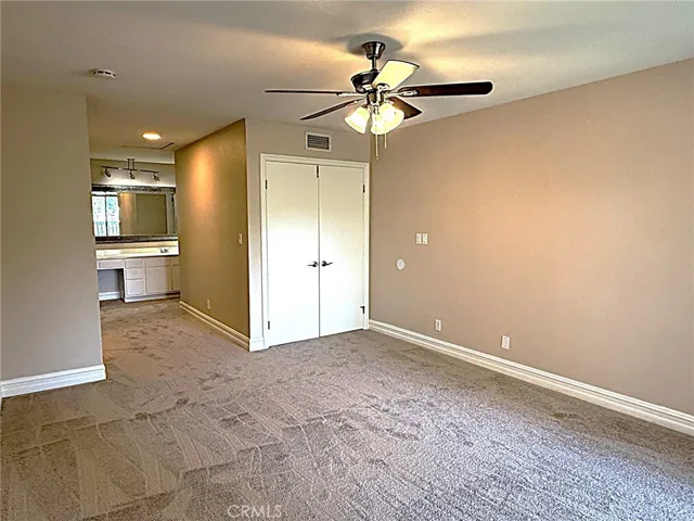 Primary bedroom that has double door entry.