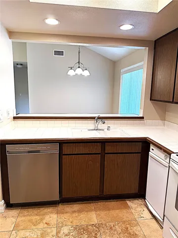 Kitchen with breakfast bar to dining room.