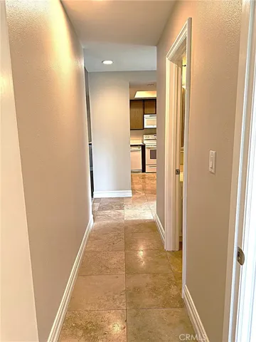 Hallway from bedroom two on the opposite side of the condo from the primary.