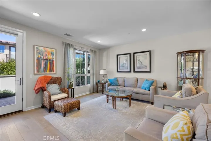 Living room with tons of natural light and a door leading to your private patio.
