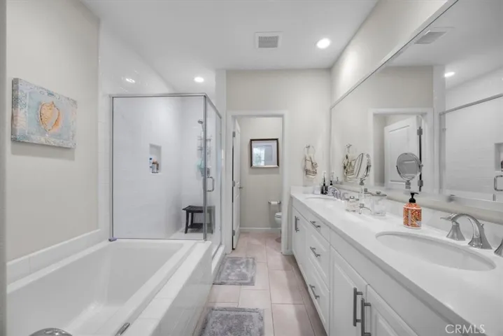 Gorgeous Primary bathroom with separate shower and bathtub