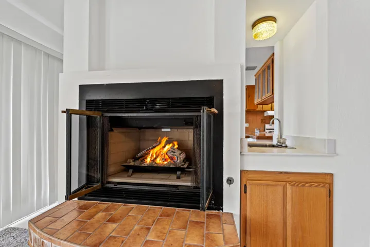 fireplace and kitchen pass through area