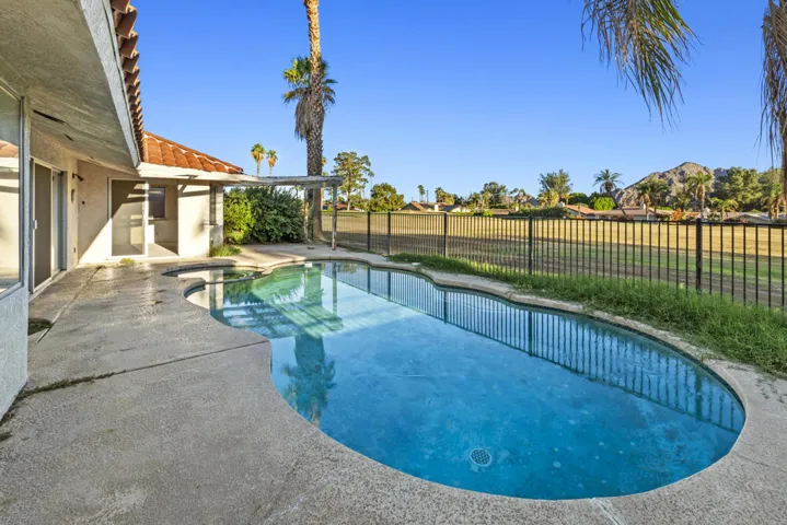 pool and spa with golf course view