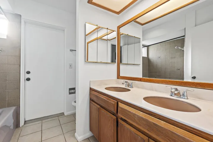 second bathroom with tub and exit door t