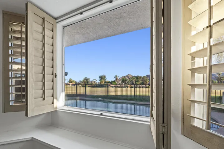 primary bedroom view to pool and beyond
