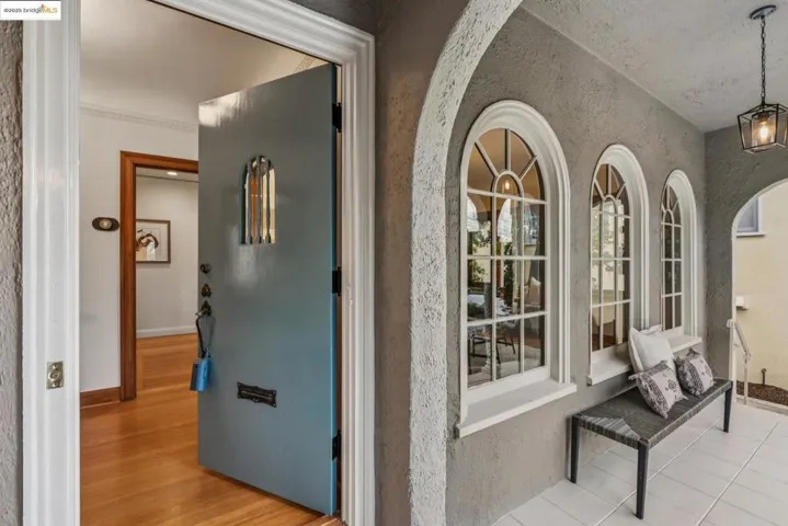 Hall with a textured wall and baseboards
