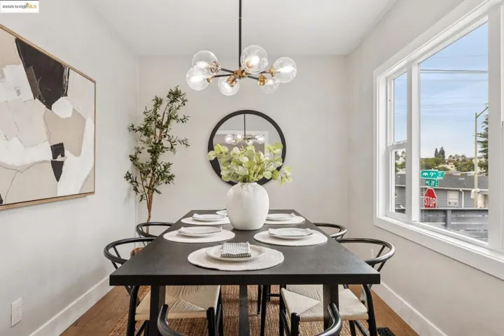Dining area with a chandelier and wood finished floors