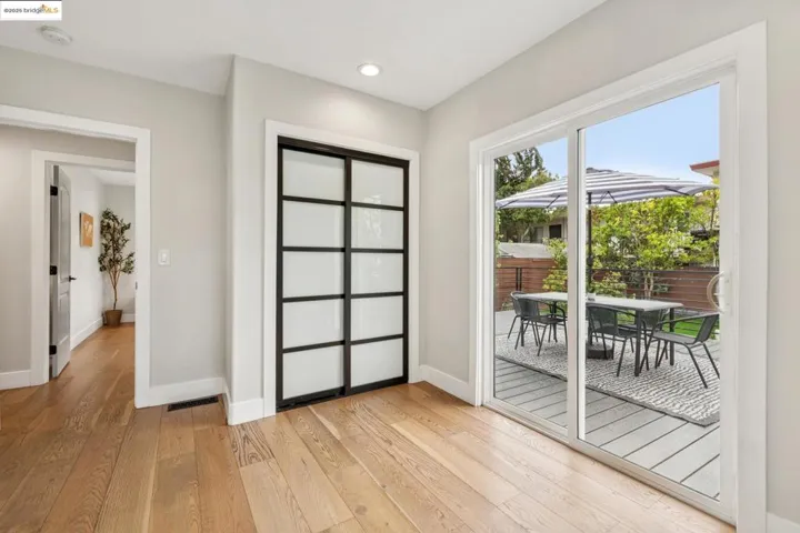 Entryway with hardwood / wood-style flooring and recessed lighting