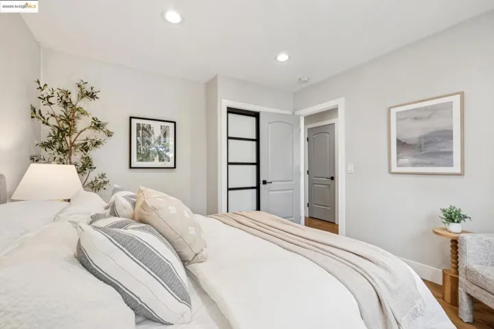 Bedroom featuring recessed lighting and wood finished floors