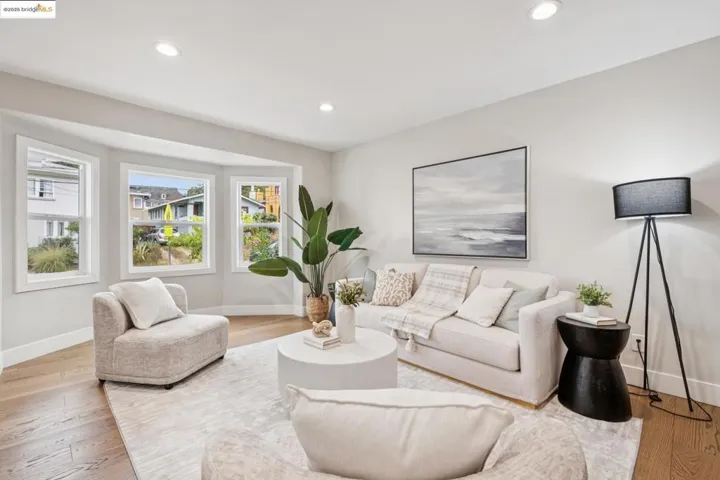 Living room featuring recessed lighting and light wood-style flooring