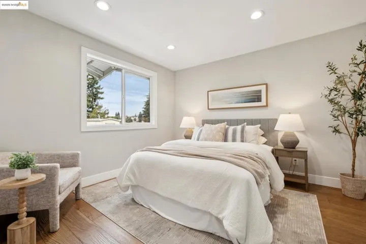 Bedroom featuring recessed lighting and wood finished floors