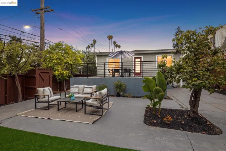 Patio terrace at dusk featuring outdoor lounge area and a patio