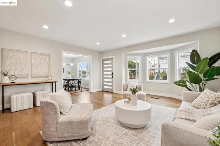 Living room featuring recessed lighting, wood finished floors, and a chandelier