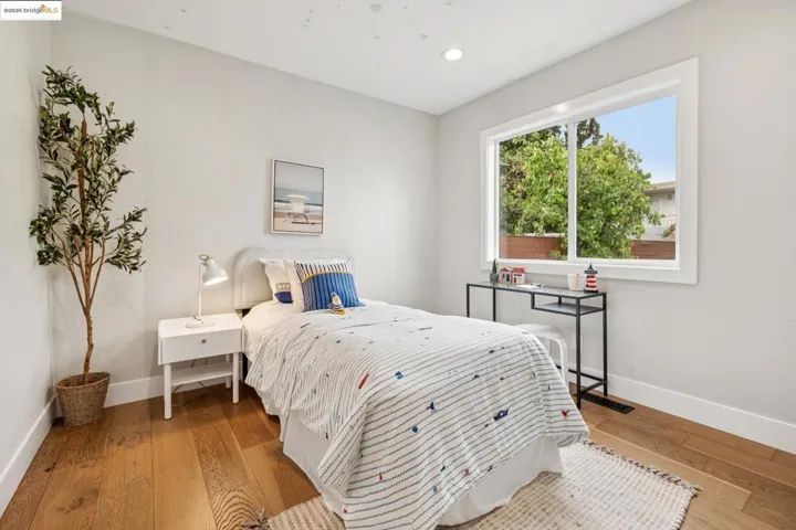 Bedroom featuring hardwood / wood-style floors and recessed lighting