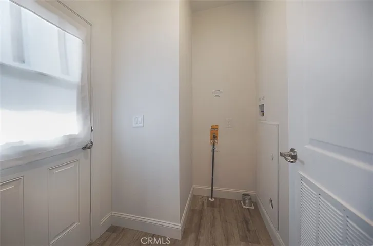 Laundry area with access to back door