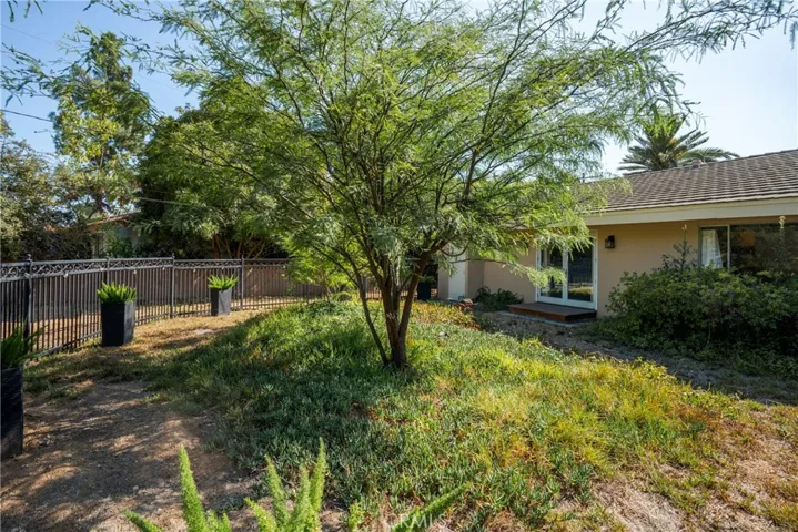 Primary Bedroom Opens to Fenced Back Yard Area
