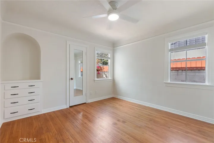 Primary Bedroom with walk in closet, built in storage, lots of natural light