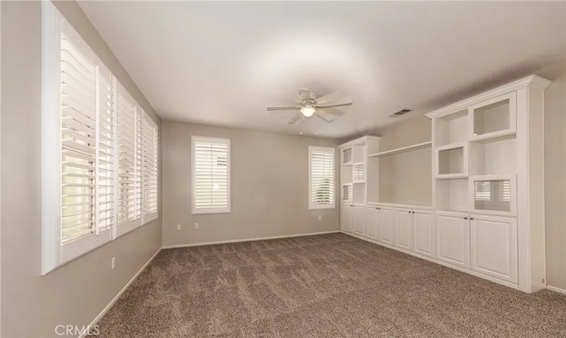 Living Room with Built In Cabinets, Plantation Shutters