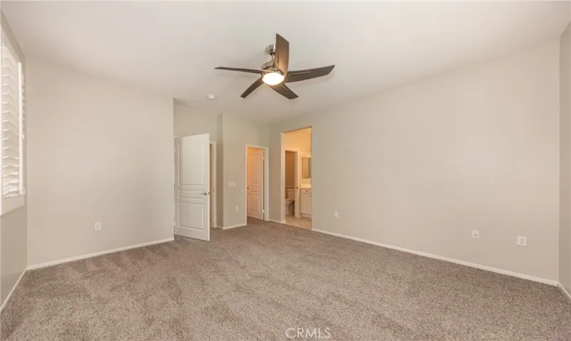 Main Bedroom with Ceiling Fan, New Carpet, New Paint, Plantation Shutters, View of the Golf Course