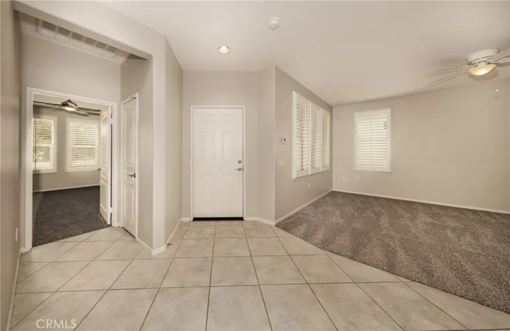 Front Entry to Home with Coat Closet Living Room to the Right and Main Bedroom to the Left